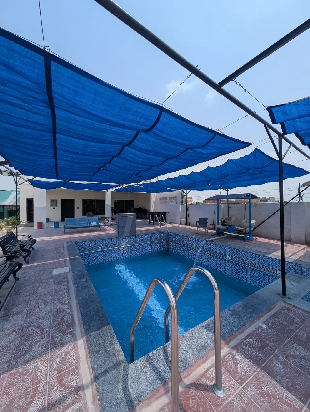 Kosam Farms pool close-up with water feature flowing