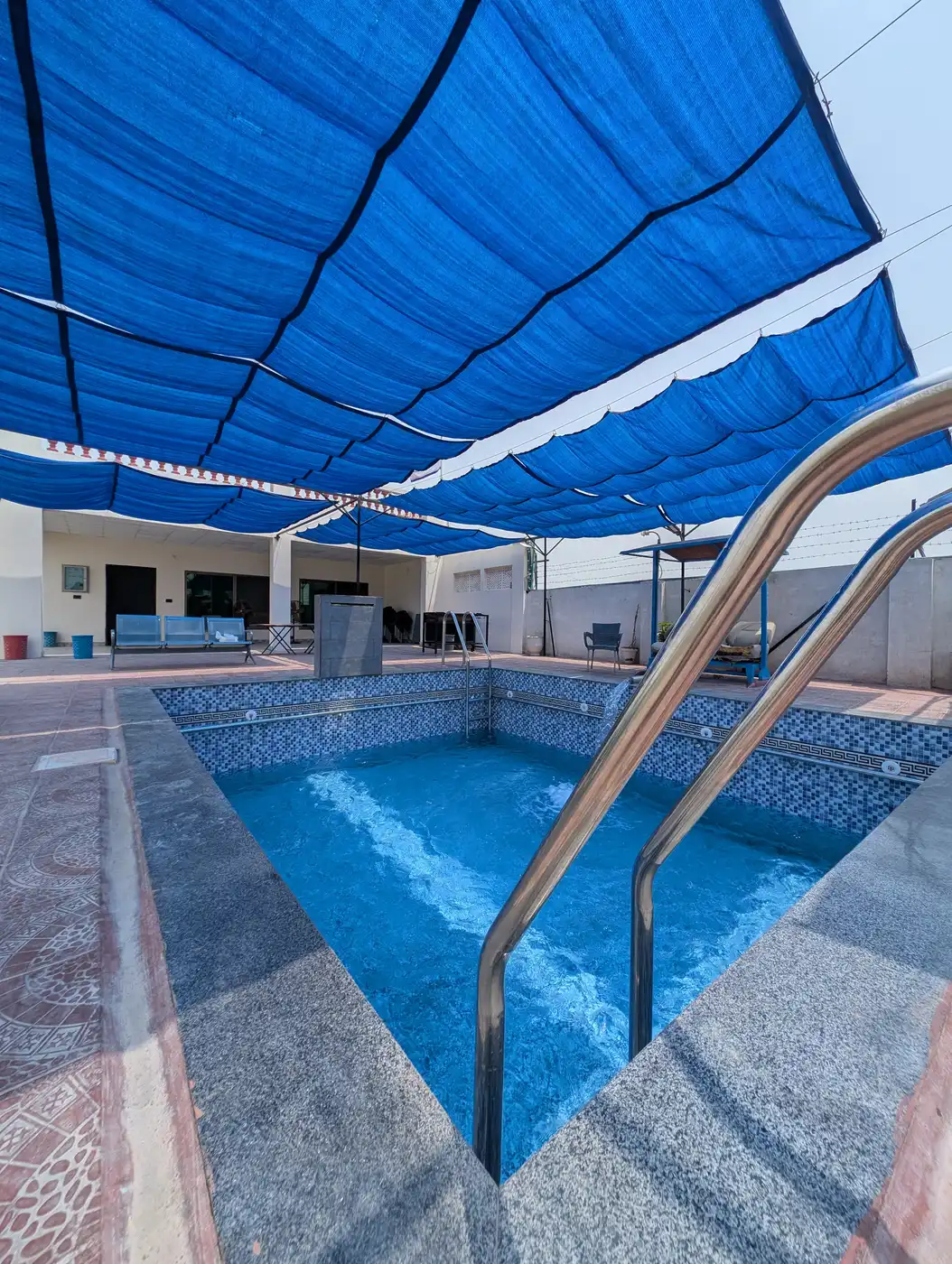 Kosam Farms pool steps and tiled edge detail